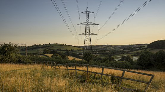 Pylon in a country landscape with power lines overhead
