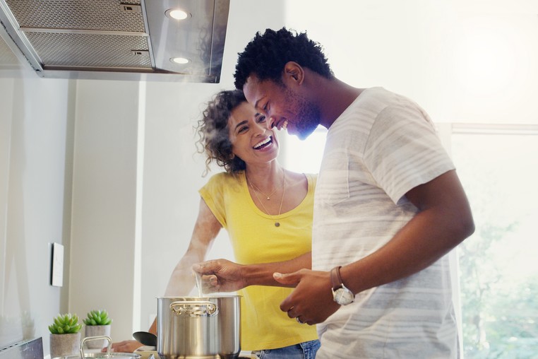 Couple cooking in kitchen