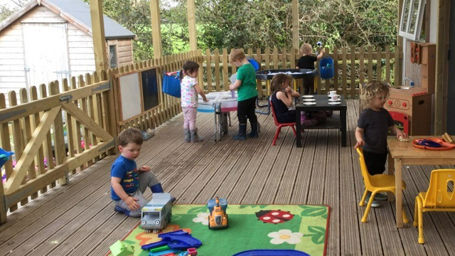 Children playing on new school decking