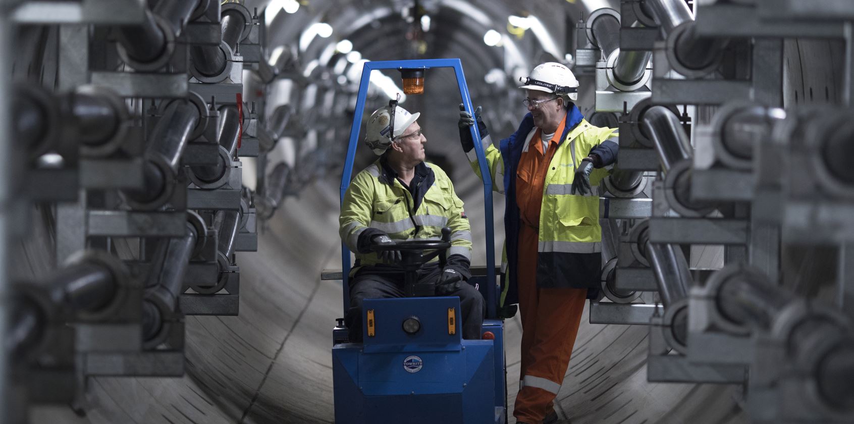 Two male workers in tunnel