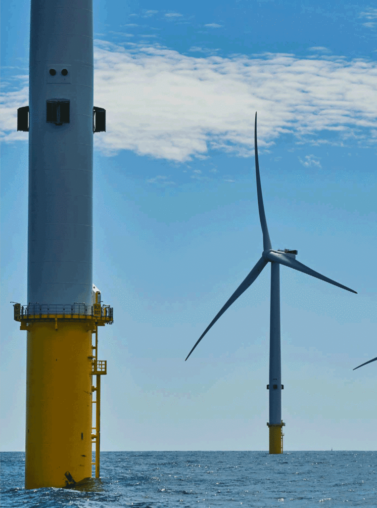 Close-up of wind turbines at offshore wind farm