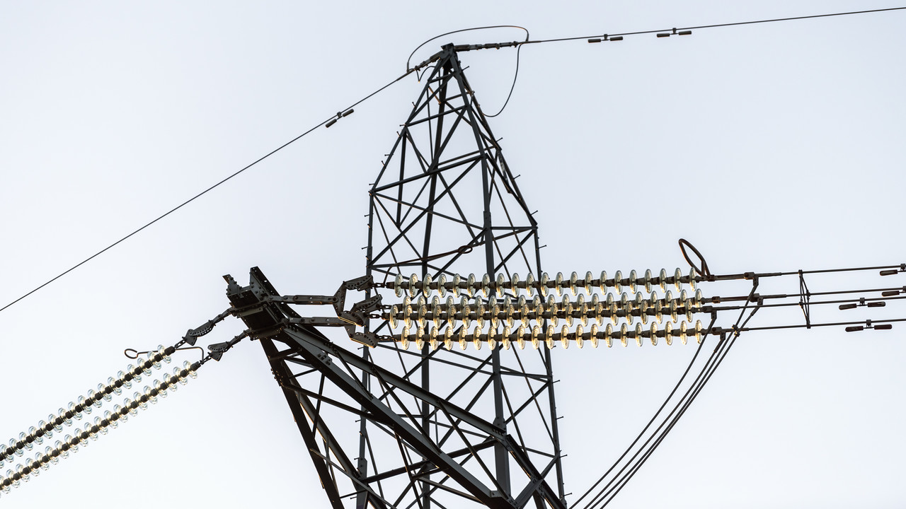 Close-up of conductors at the top of an electricity transmission pylon