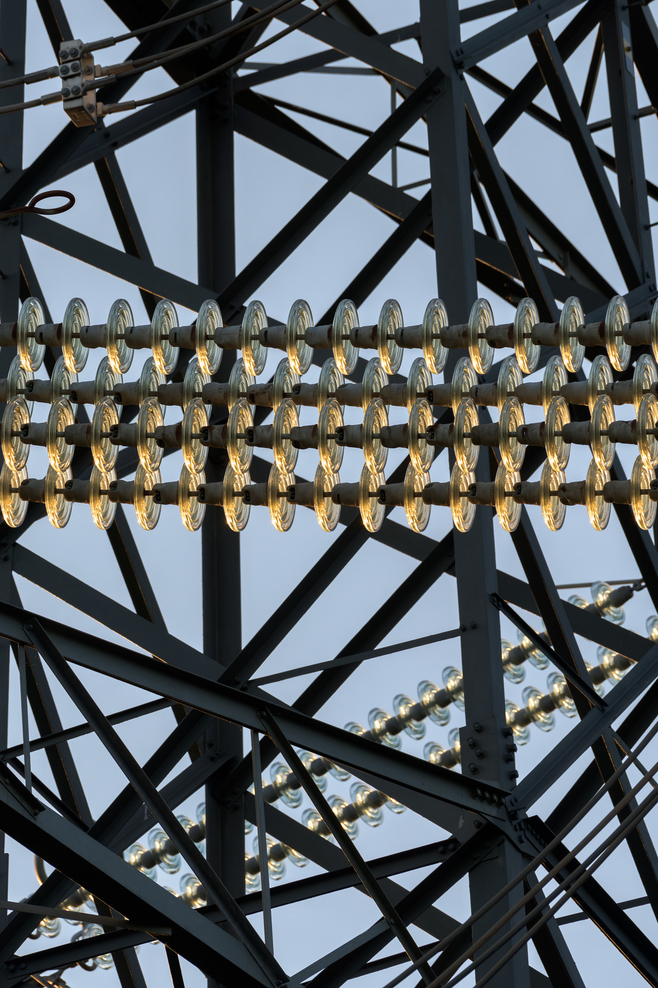 Close up of conductors on an electricity transmission pylon