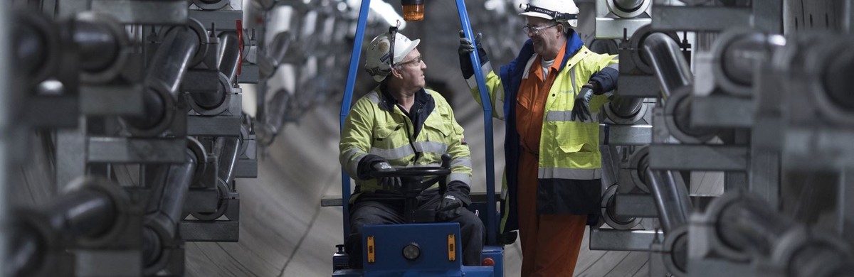 Two male workers in tunnel