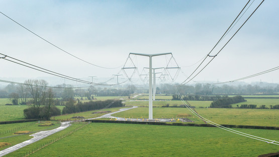 T-pylons and overhead electricity lines in green fields