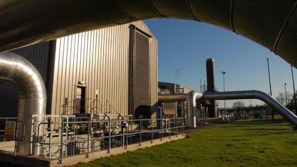 Partial view of a gas transmission site with a blue sky in the background 