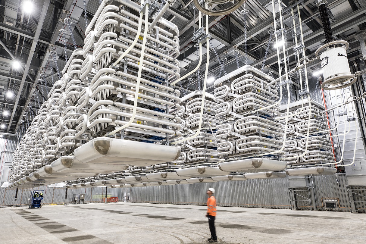 IFA Interconnector - Valve Hall shown with an employee present