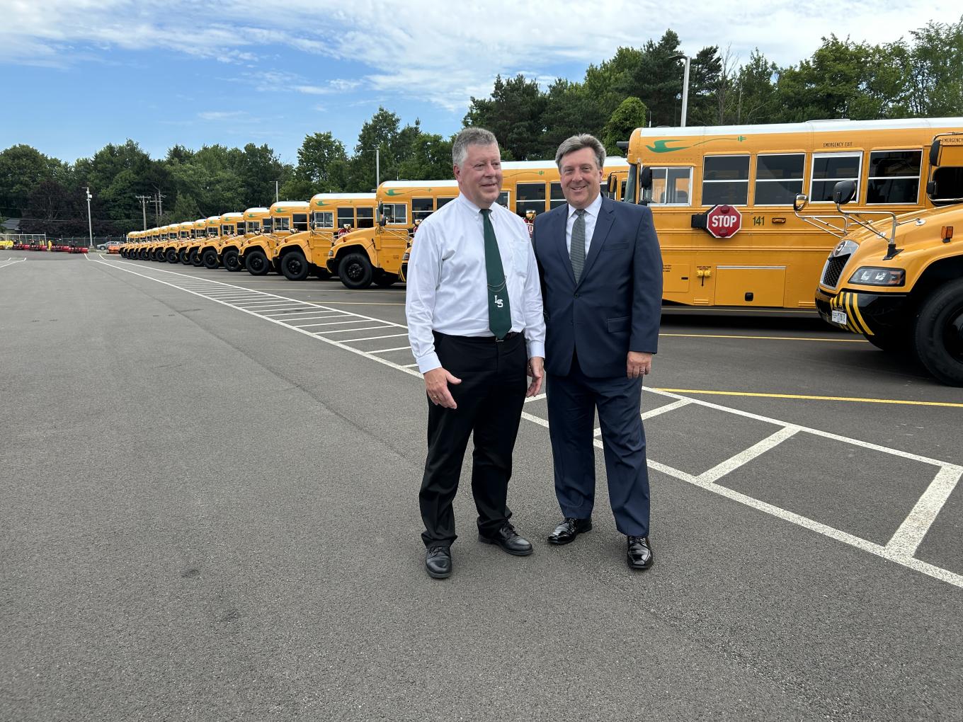 2 people Standing ahead of a Building