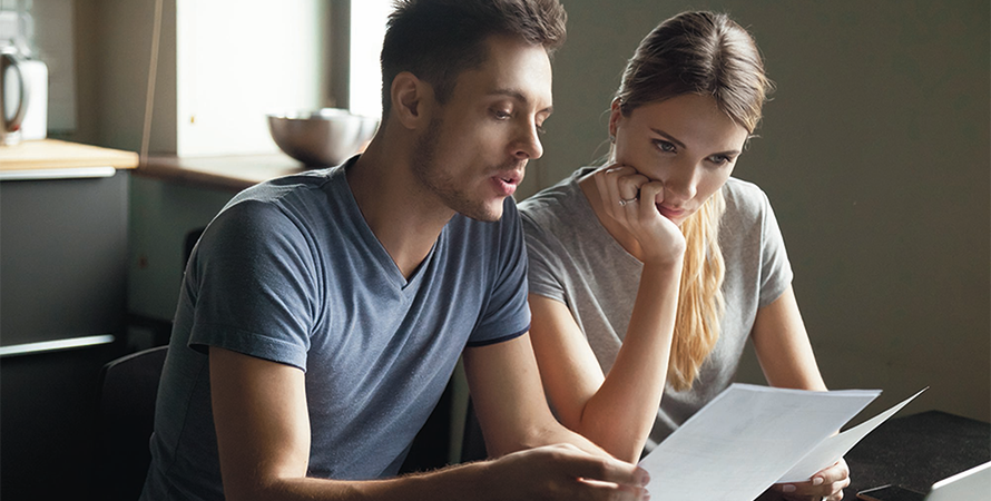 2 people reading a paper