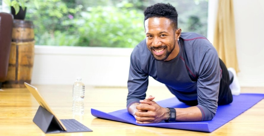 Man doing fitness exercise on mat