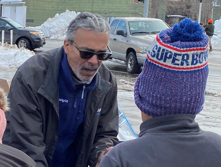 Two people talking outdoors in a snowy environment 