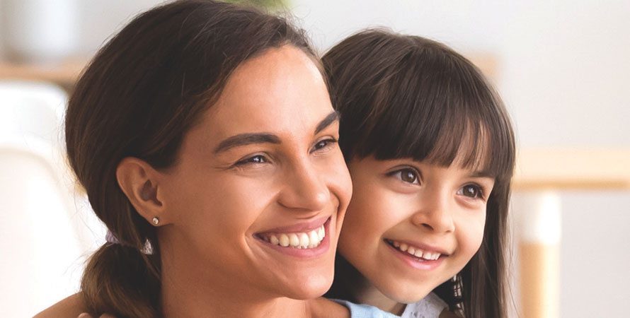 Mother and daughter smiling portrait
