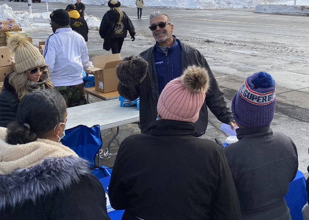 Community volunteers distributing supplies outdoor