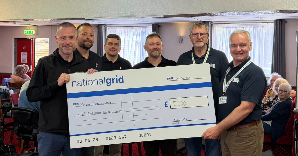 An image showing NGV and Veterans Outreach Support staff with a cheque at the donation handover.