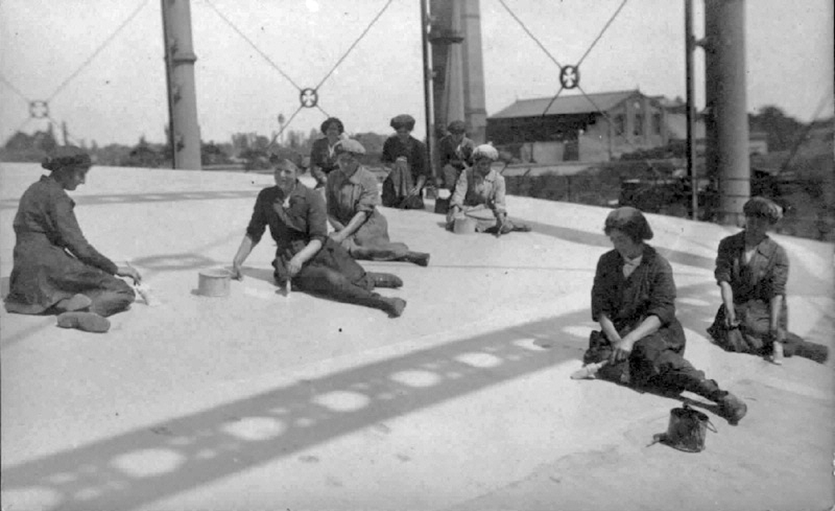 Archive image of women painting the top of a gas holder - used in the National Grid story 'Time travelling through the history of energy at the National Grid archive'