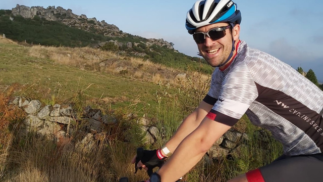 Close-up of National Grid's David Welling on his bike wearing a helmet