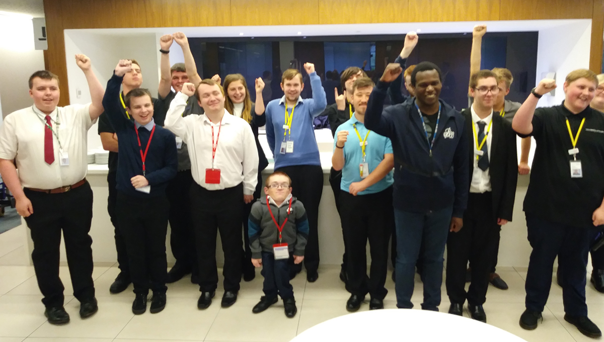 EmployAbility interns celebrating with hands in the air - used for the National Grid story 'EmployAbility supported internships: helping young people with learning disabilities get into employment'