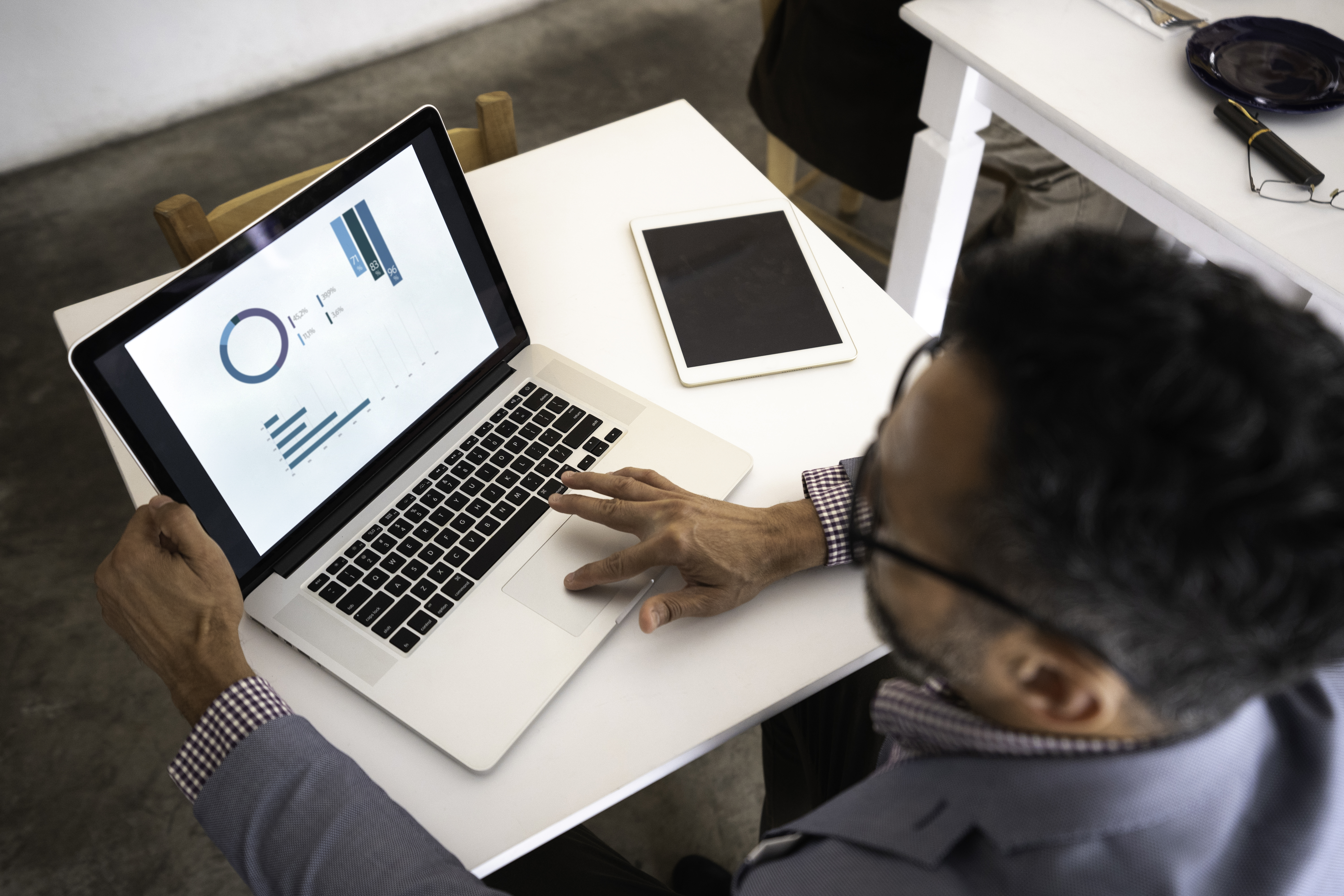 Man viewing reports on laptop