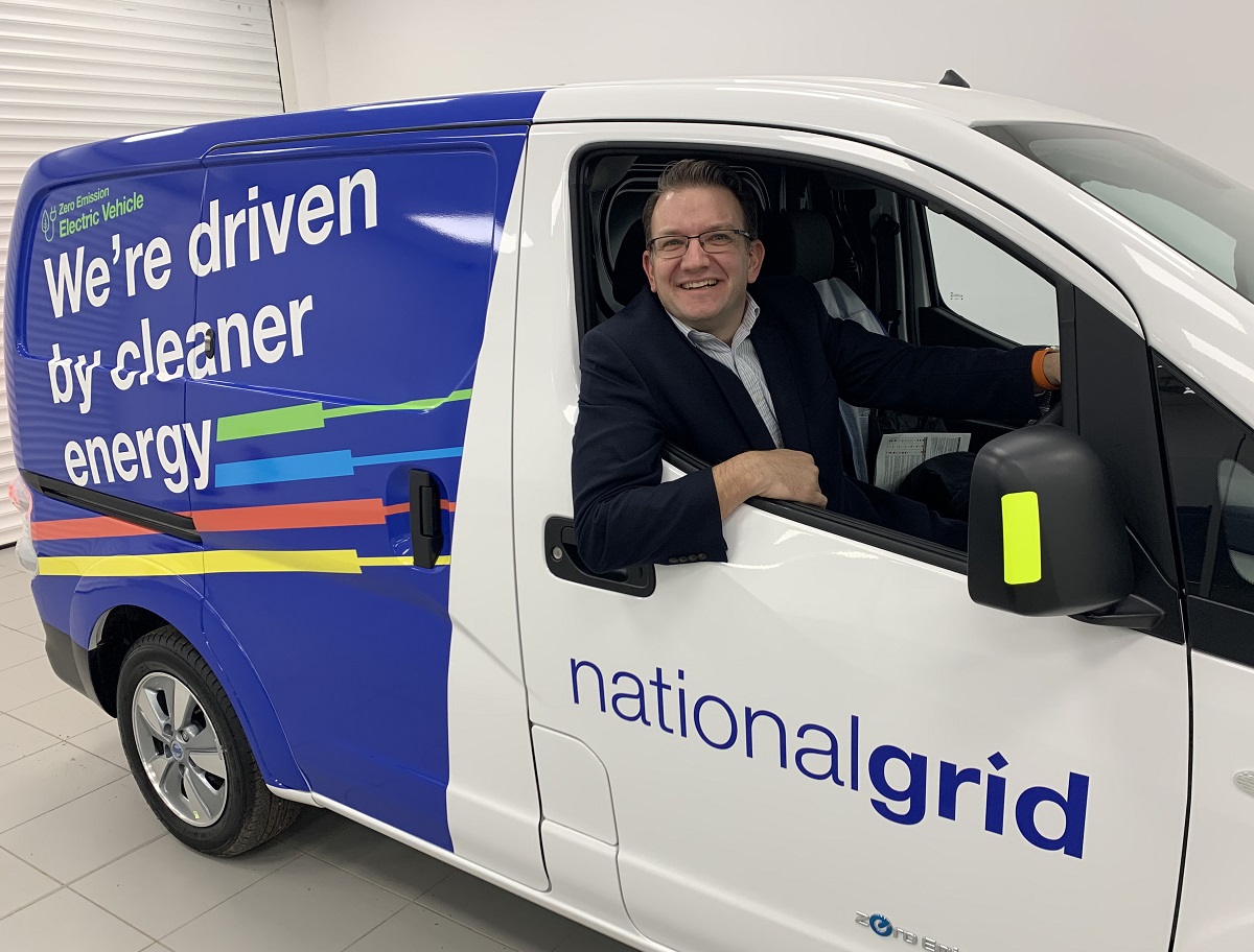 Graeme Cooper sitting in new National Grid ENV-200 electric van