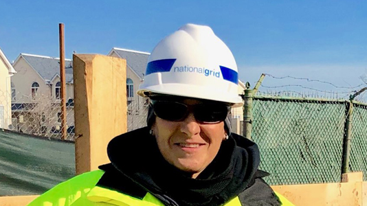 Female US National Grid engineer wearing hard hat