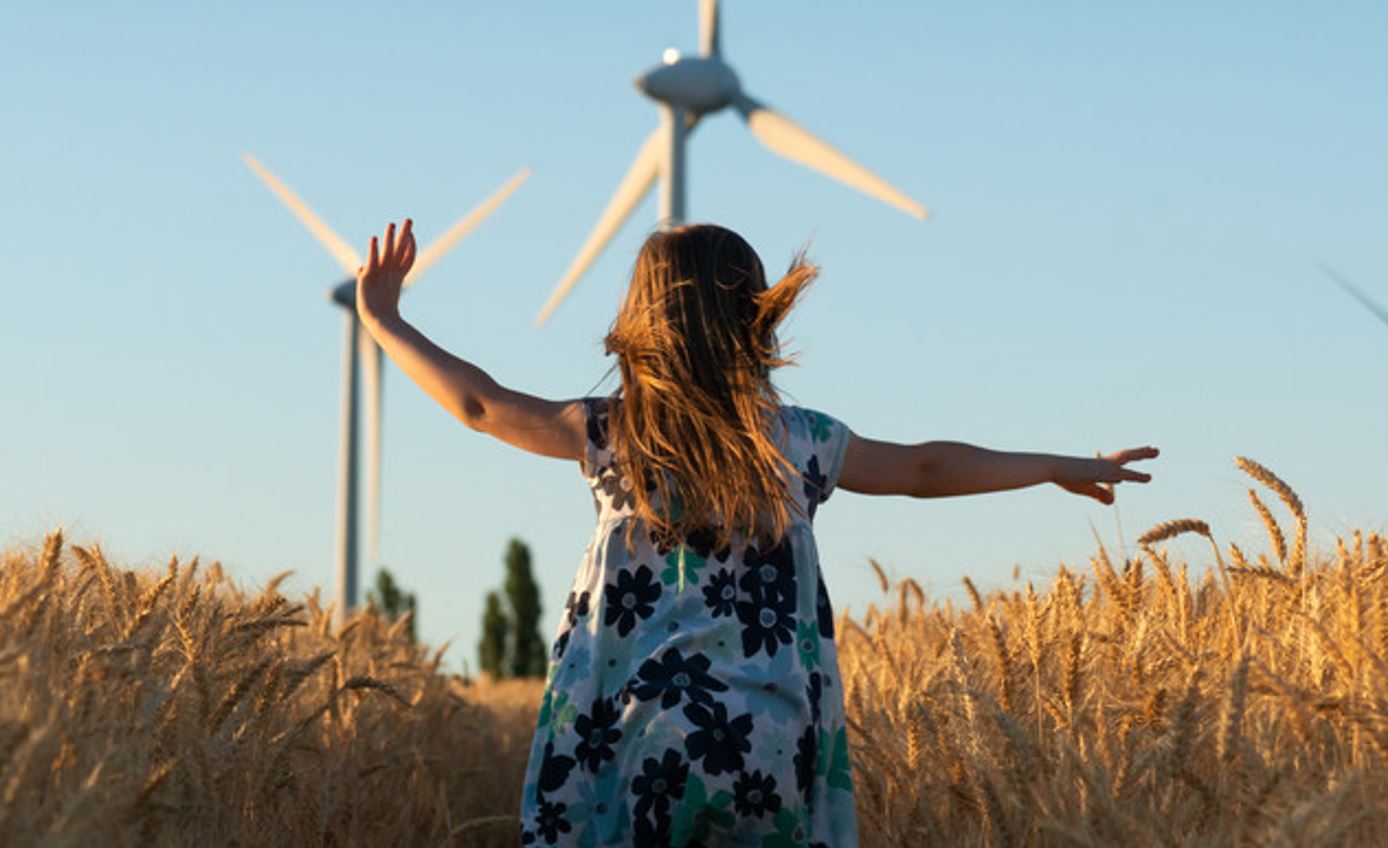 Girl running through field