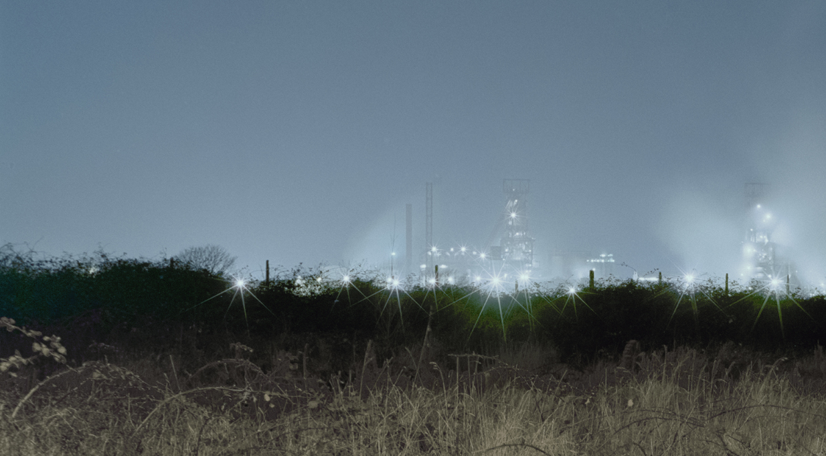 Lights from Steelworks in the distance at night