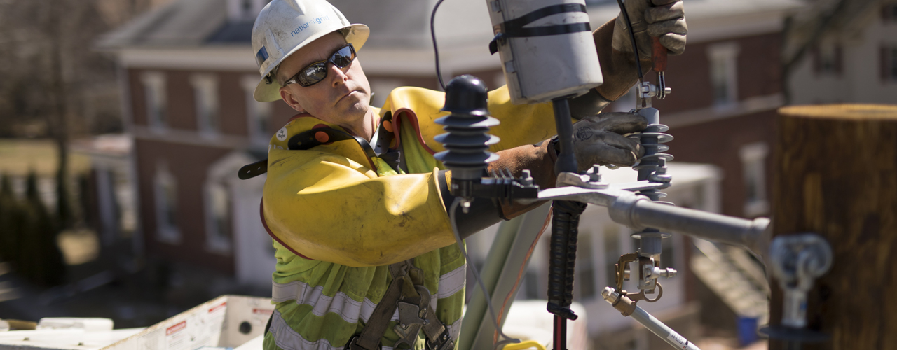 Linesman wearing PPE working on overhead line
