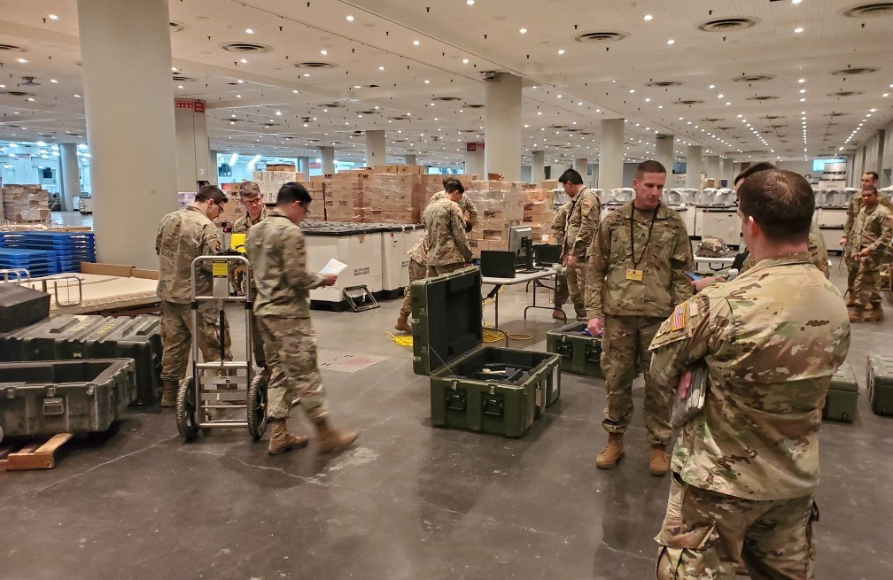 US military personnel in warehouse serving for National Guard - used for 'From National Grid to National Guard' story