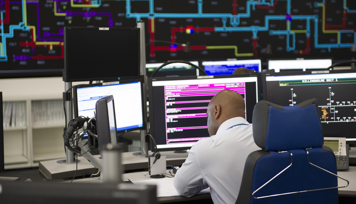 Man working at desk in control room - used for the National Grid story 'Working round the clock to power the nation at Easter'