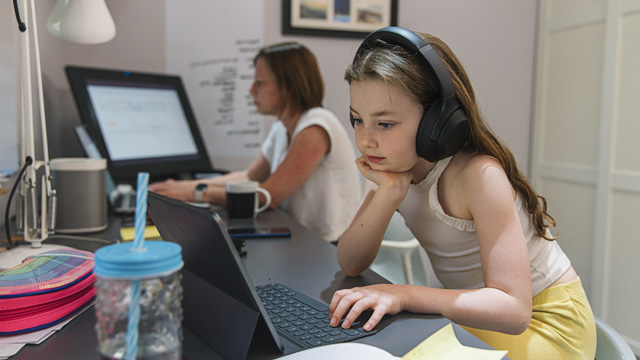 Young girl remote schooling in study with mother - used for National Grid story COVID-19 effect on electricity use