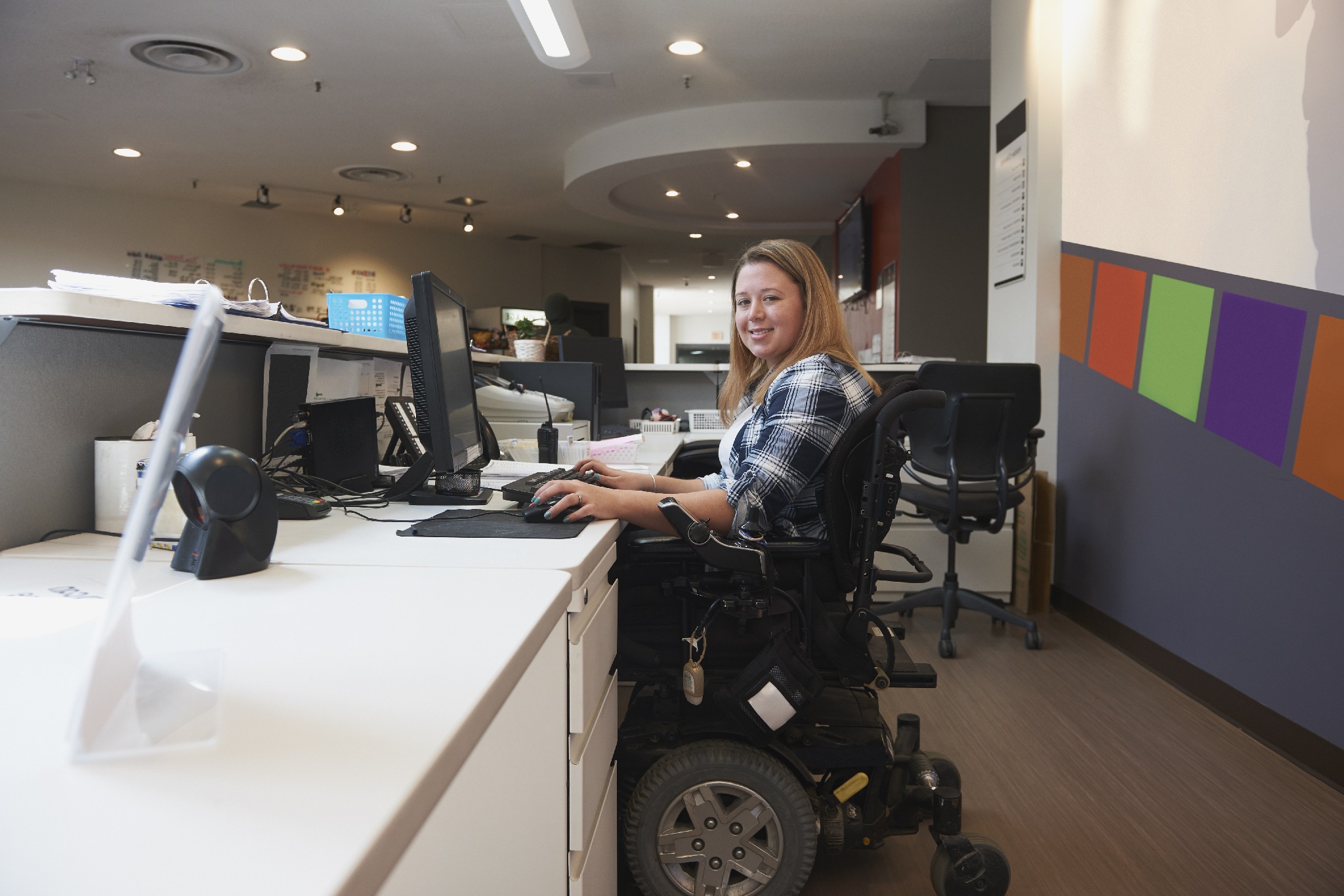 Young woman in wheelchair for National Grid article on disability