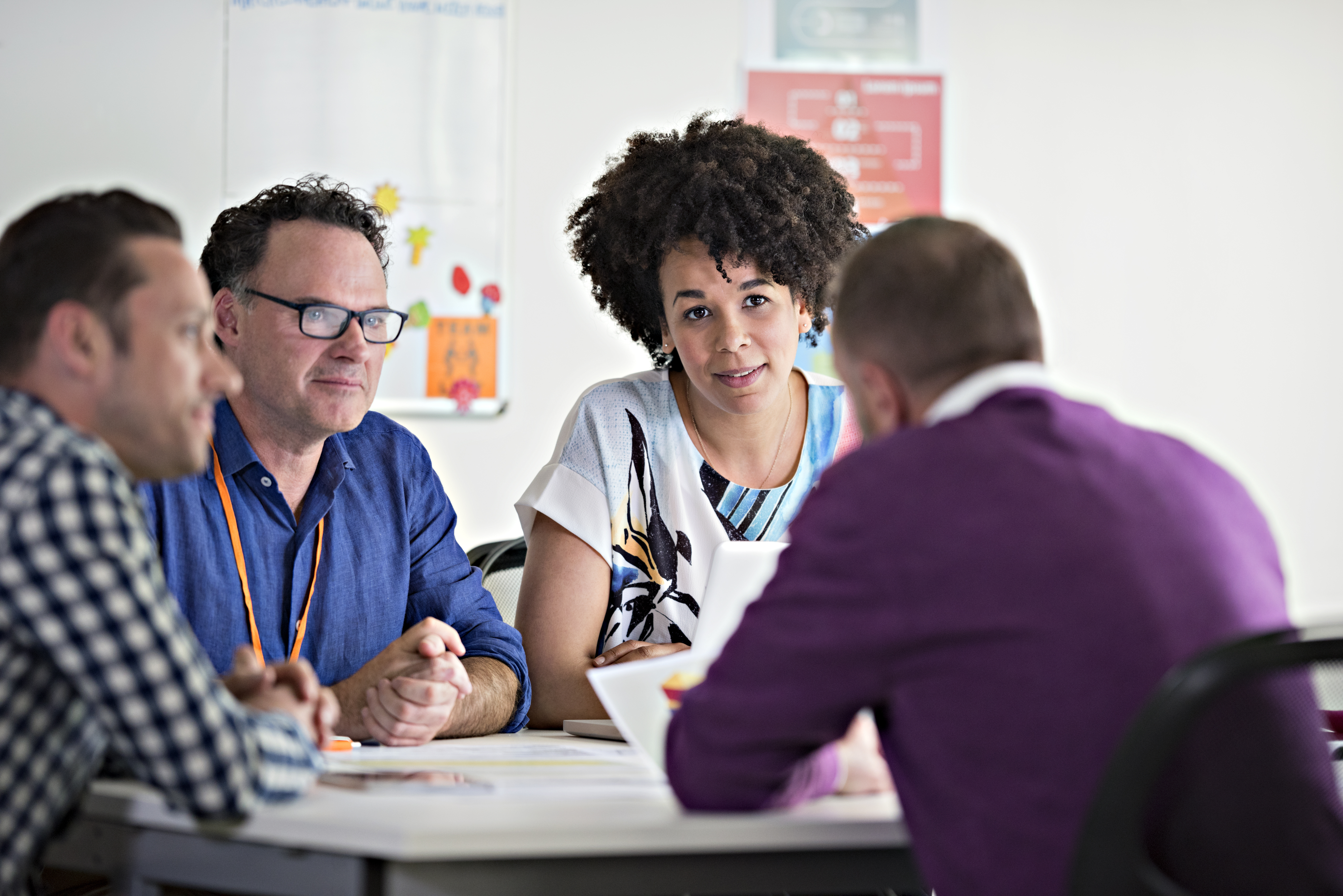 Office workers meeting around a table