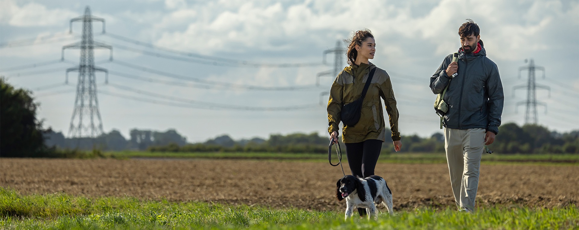 Man and woman walking dog