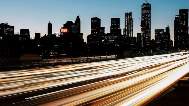 Abstract car lights along a US highway with city in the background