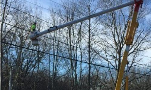 Utility bucket truck working on lines