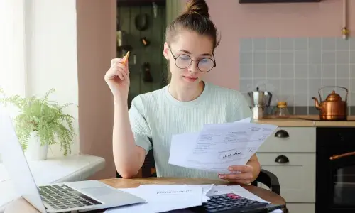 Woman Looking at her Bill