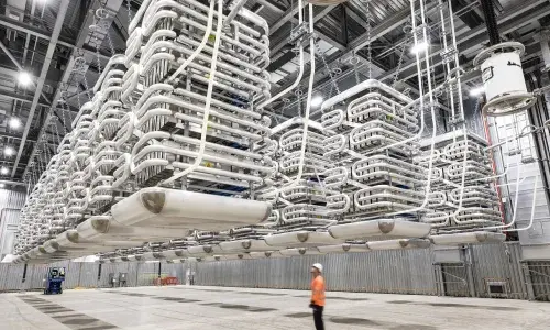 IFA Interconnector - Valve Hall shown with an employee present