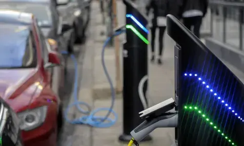 Electric car charging in street for National Grid article