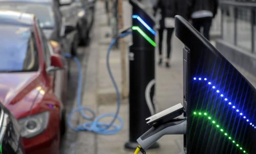 Electric car charging in street for National Grid article