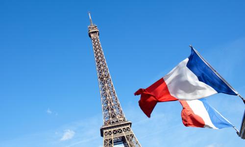 Eiffel Tower with french flag for National Grid Paris Agreement article