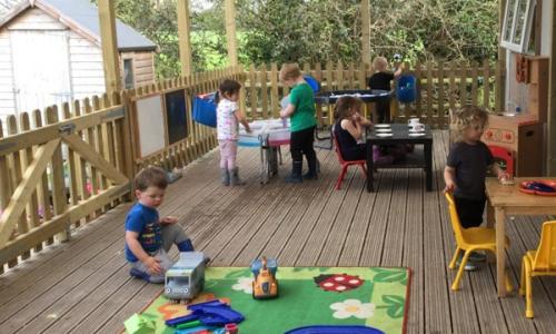 Children playing on new school decking