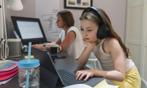 Young girl remote schooling in study with mother - used for National Grid story COVID-19 effect on electricity use