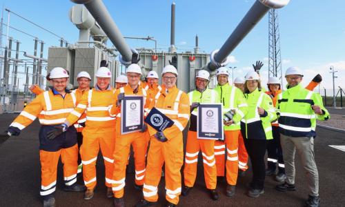 Viking Link team members holding the Guinness World Record certificates and plaque