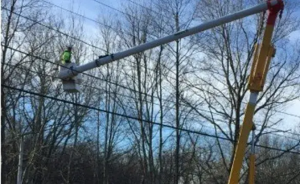 Utility bucket truck working on lines