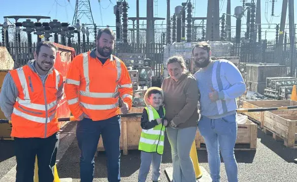 Ted with his parents and National Grid team members