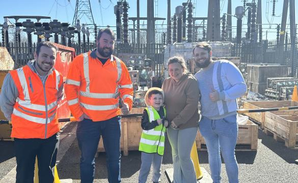Ted with his parents and National Grid team members