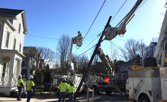 National Grid operatives restore a pole taken down in Storm Riley
