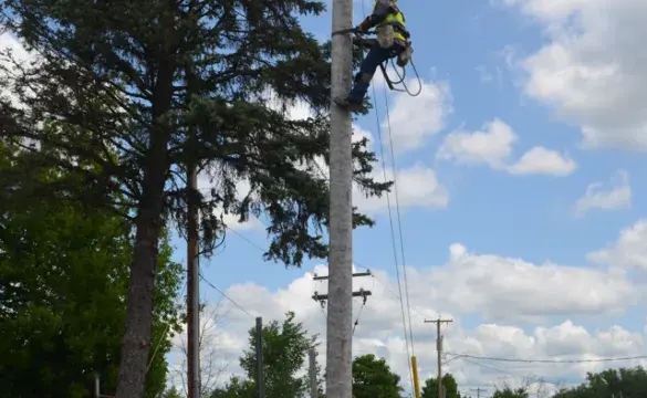 A man standing on a pole
