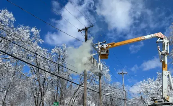 Storm response utility crew repairing power lines