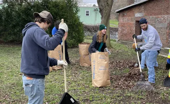 Earth Day volunteers Cleaning Yard